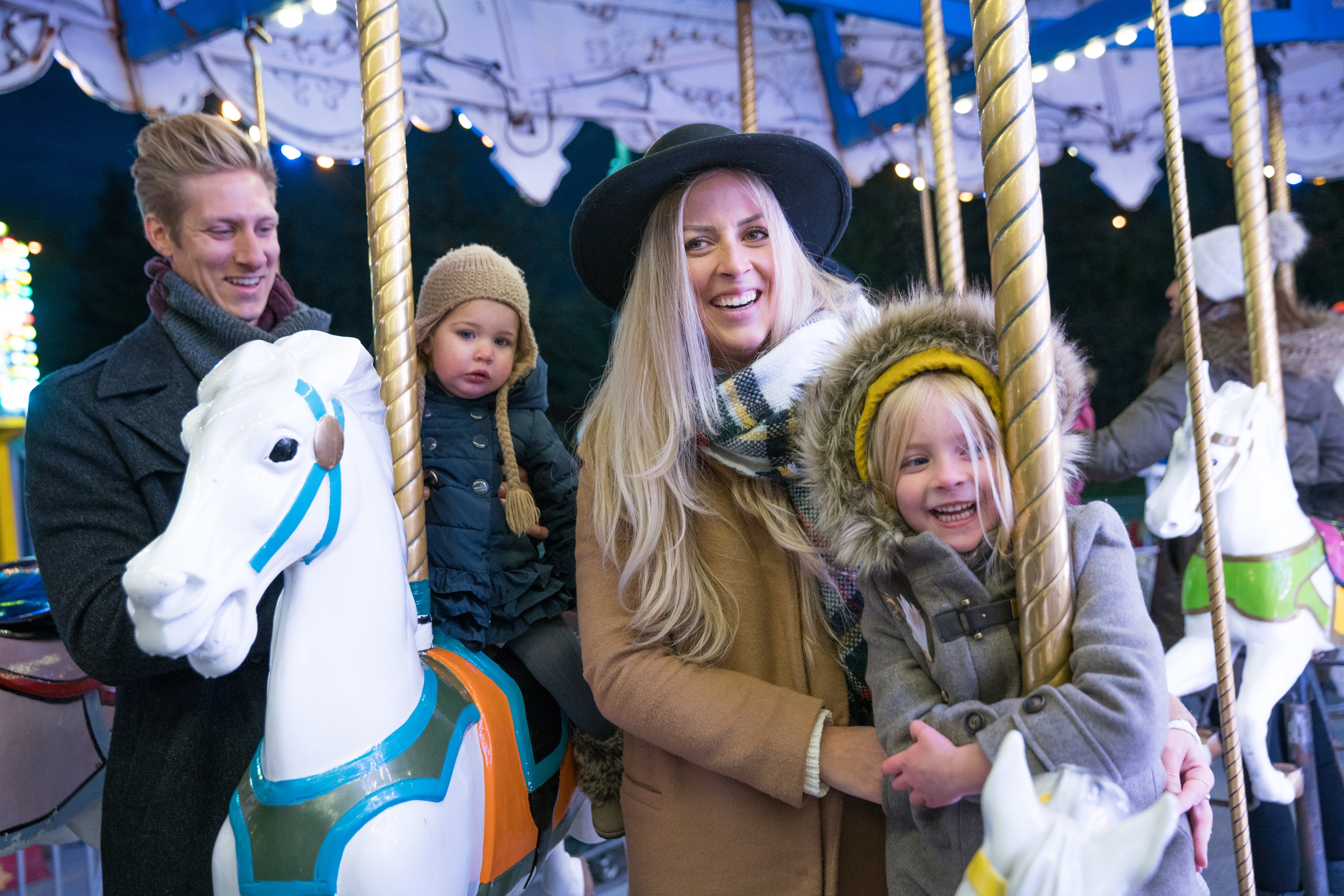 files/smiling-family-on-merry-go-round.jpg
